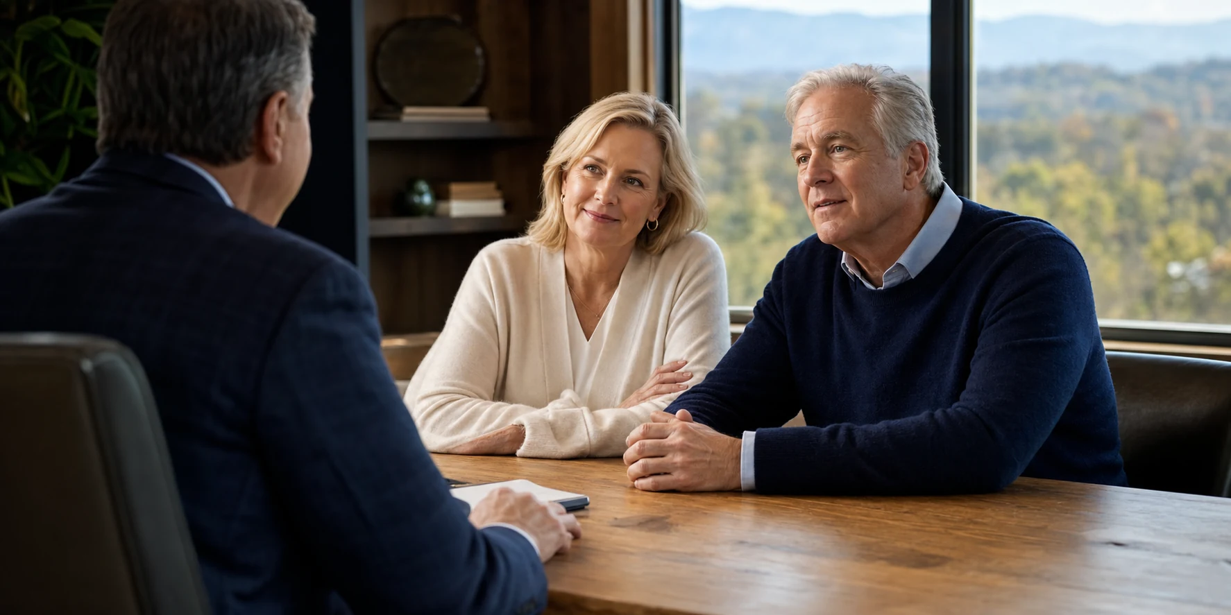 A couple having a thoughtful financial planning conversation with an advisor